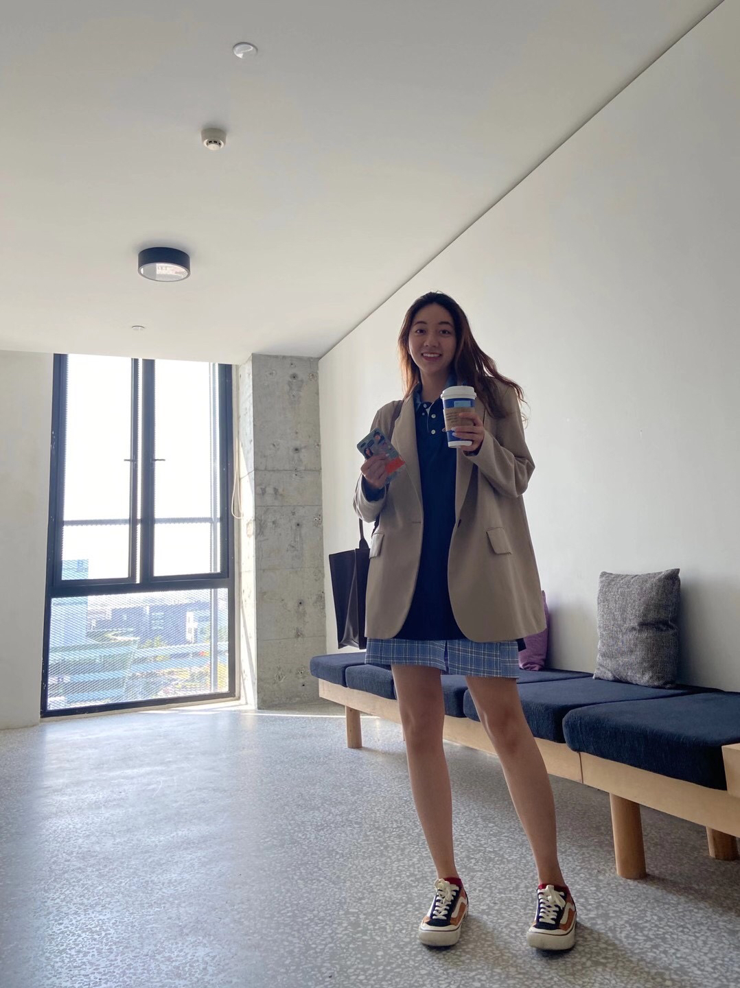 holding coffee dress